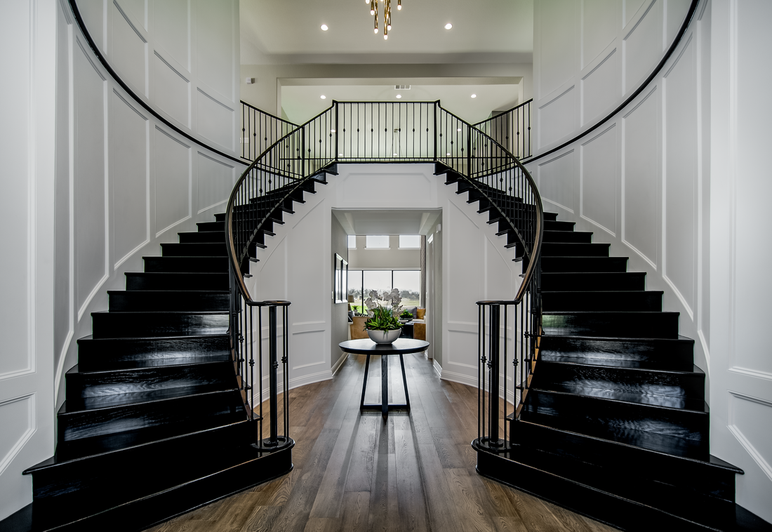 Black staricase with white pannels in luxury home in Dallas Texas