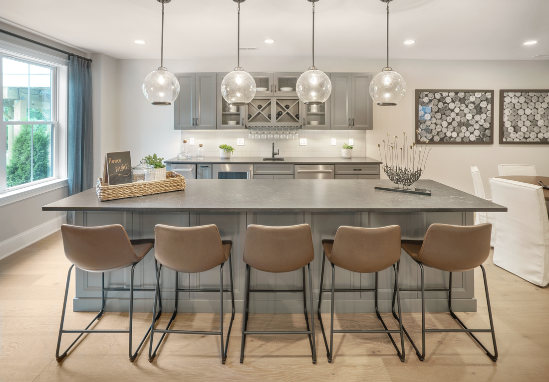 Gray bar in basement with globe pendant lighting and silver accents